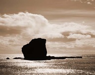 The sparkling light of the sea in late morning highlights Pu`upehe